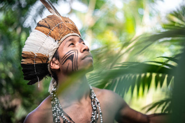 istock Indigenous Brazilian Young Man Exploring the Rainforest - from Guarani Ethnicity 1019095874