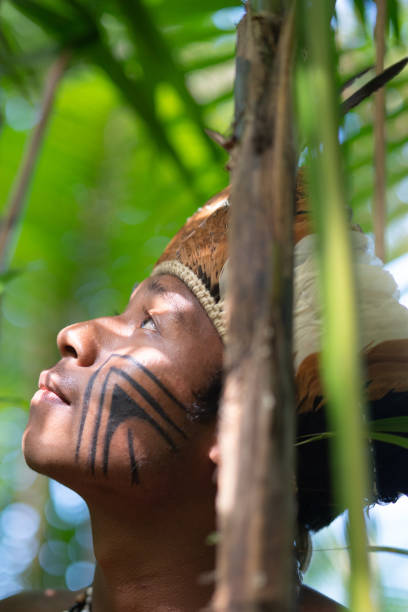 Indigenous Brazilian Young Man Exploring the Rainforest - from Guarani Ethnicity