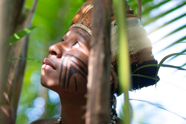 istock Indigenous Brazilian Young Man Exploring the Rainforest - from Guarani Ethnicity 1019098078