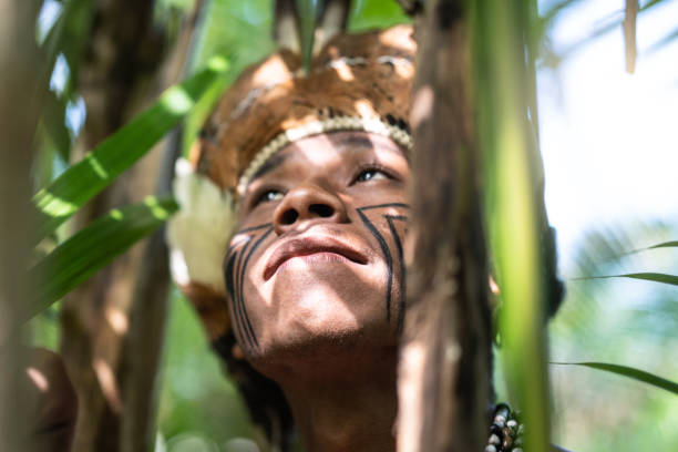 istock Indigenous Brazilian Young Man Exploring the Rainforest - from Guarani Ethnicity 1019098132