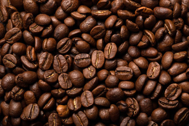 istock Close-up roasted coffee beans background. Top view 1019098200