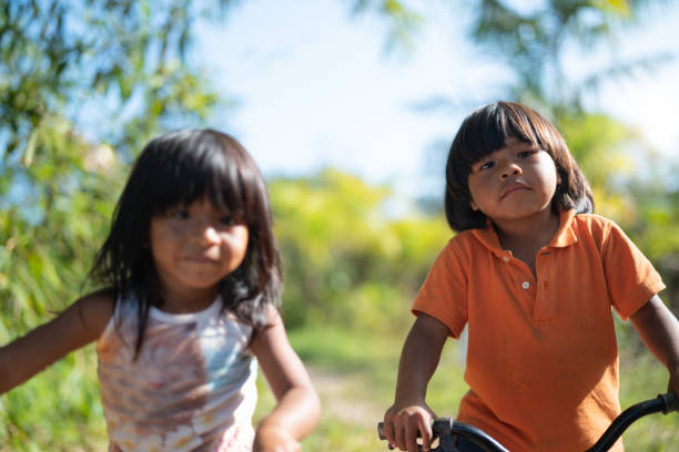 istock Siblings Riding a Bicycle in a Rural Place 1019105688