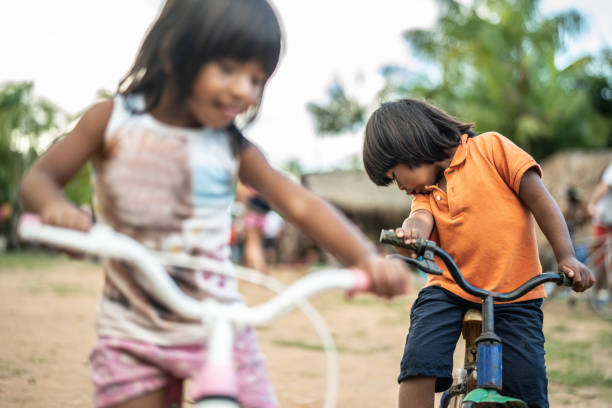 istock Siblings Riding a Bicycle in a Rural Place 1019106944