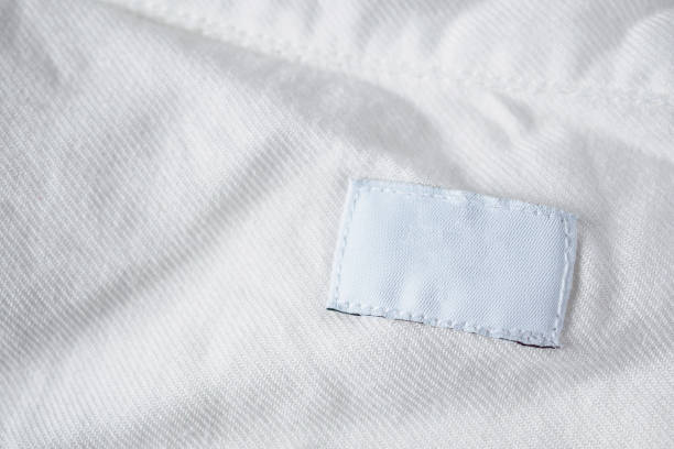 istock White blank laundry care clothes label on cotton shirt 1019109852