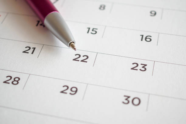 istock Calendar page with pen point at 22nd date 1019110044