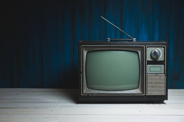 istock Vintage TV on wooden floor 1019110836