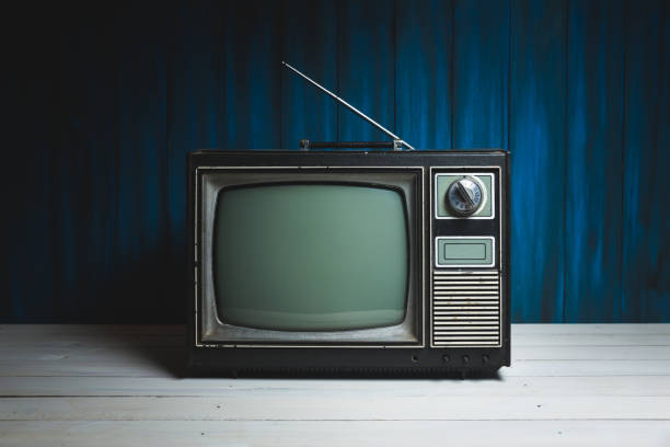 istock Vintage TV on wooden floor 1019110874