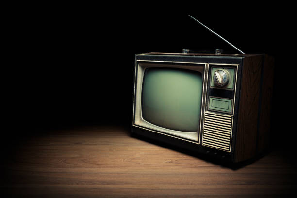 istock Vintage TV on wooden floor 1019110940