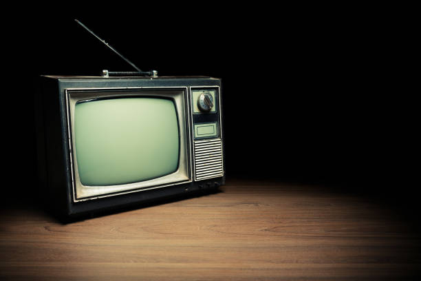 istock Vintage TV on wooden floor 1019113618