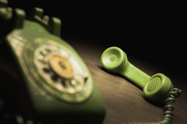 istock Old rotary telephone on wooden surface 1019121024