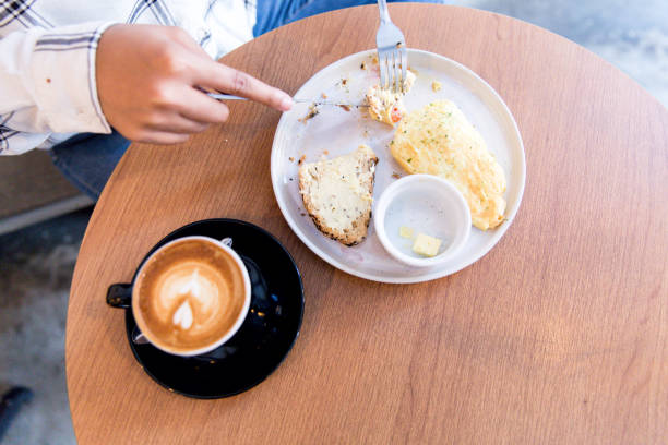 istock One women having breakfast and coffee 1019121298