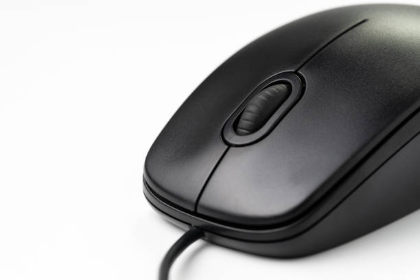 Close-up of black computer mouse with middle scroll wheel and cord on white background, website seo, internet or intention to click concept