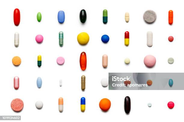 Array Of Large Group Of Assorted Capsules And Pills On White Background High Resolution Image Stock Photo - Download Image Now