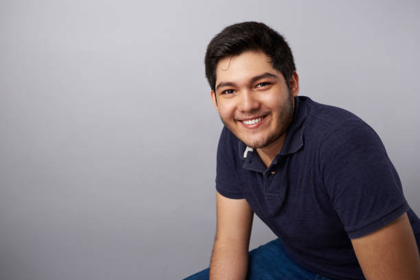 istock Cheerful smiling young hispanic man 1019139118
