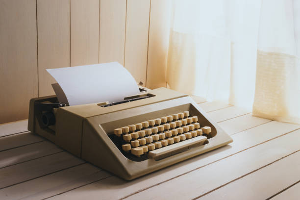 istock Vintage typewriter on wooden desk 1019143814