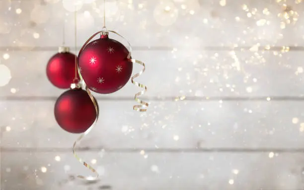 Photo of Christmas Holiday Baubles with Gold Ribbon against an Old Wooden Background