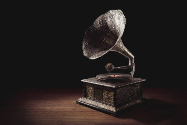 istock Vintage gramophone on wooden background 1019146194