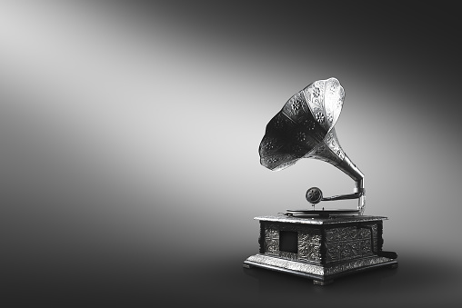 Old gramophone on a gray background