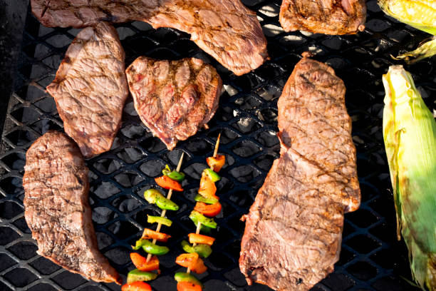 istock Mixed Grill with Shish Kebabs, Beef Steaks and Corn on the Cob 1019168042