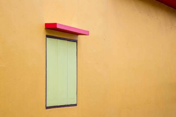 istock wooden window with red facade 1019181284