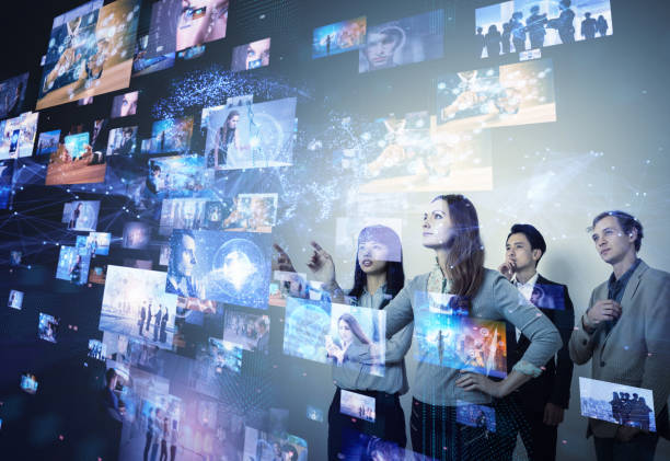 istock Group of people looking stereoscopic display. 1019181646