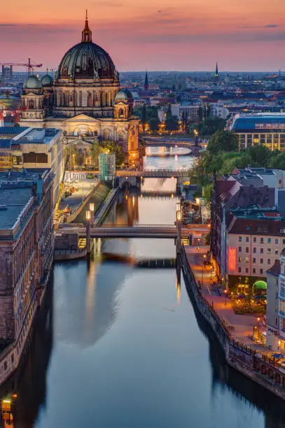 The Spree river in Berlin with the cathedral at sunset