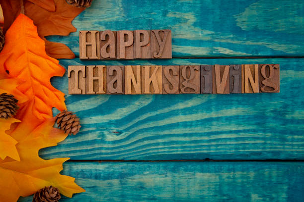 istock Happy Thanksgiving Background with Fall Leaves on Blue Wood 1019202466