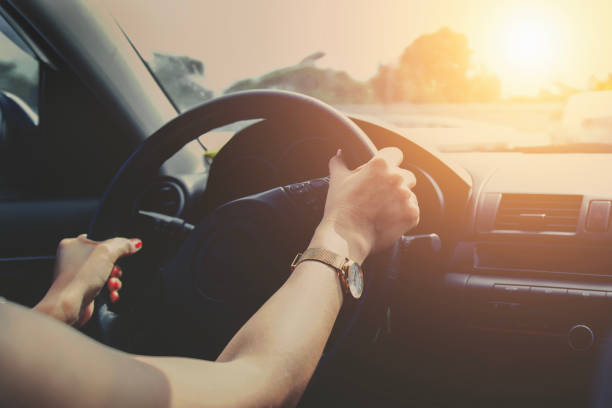 istock driving car on road with sunset. vintage tone 1019202496