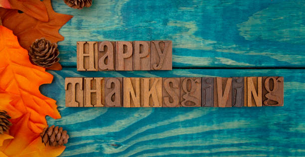 istock Happy Thanksgiving Background with Fall Leaves on Blue Wood 1019202760