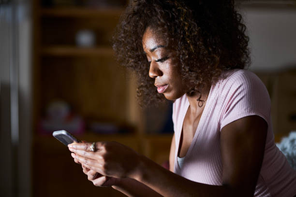 istock african american woman using smartphone 1019214138