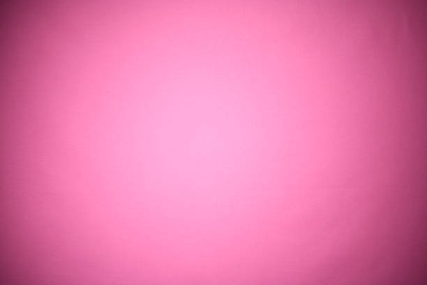 fondo de textura de tela rosa con punto iluminado - spot lit fotografías e imágenes de stock