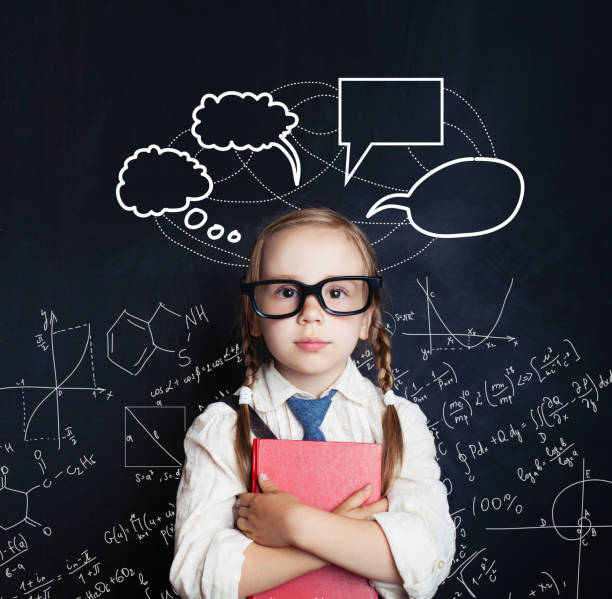 istock Tired little girl student on blackboard background with science hand drawings pattern and speech bubble 1019219844