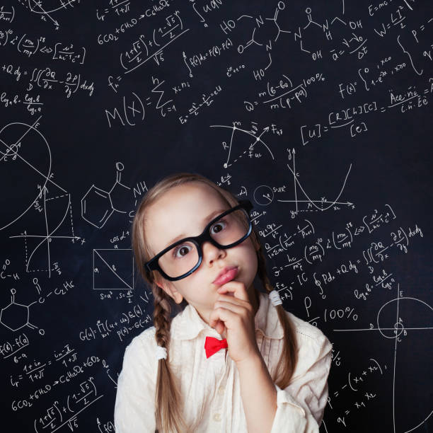 istock Thinking mathematics student on school blackboard background with chalk hand drawings science formula pattern. Kids mathematics education concept. 1019220194