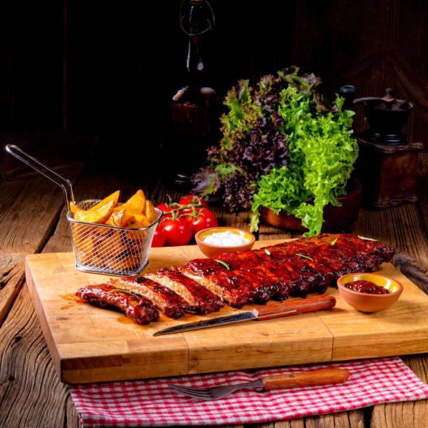 BBQ spare ribs from a charcoal grillBBQ spare ribs from a charcoal grillBBQ spare ribs from a charcoal grill