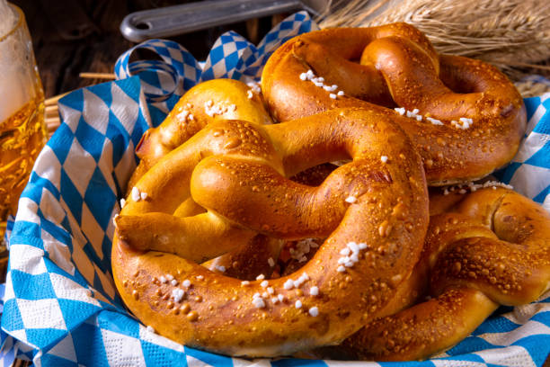 real homemade bavarian salty pretzel with beer real homemade bavarian salty pretzel with beerreal homemade bavarian salty pretzel with beer pretzel photos stock pictures, royalty-free photos & images