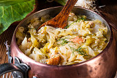 young and fresh cabbage cooked with bacon cubes