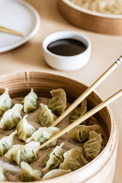 istock Asian gyoza, dumplings snack, chopsticks, steamer 1019244462