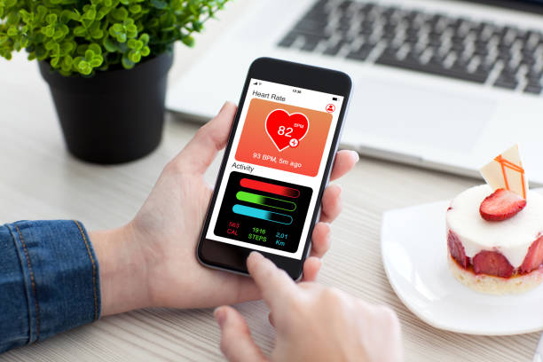 istock Women hands holding phone with app health tracking activity screen 1019259820