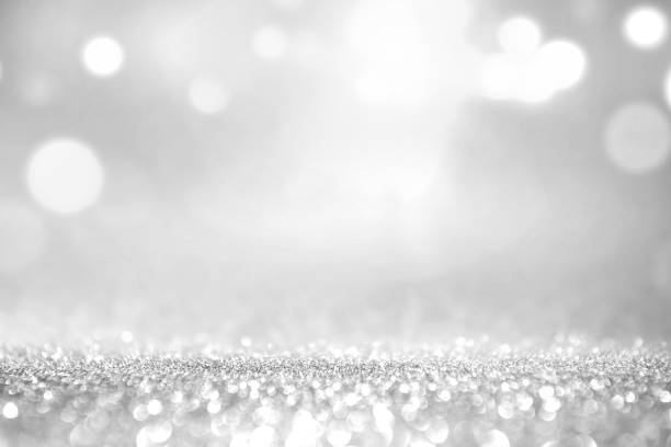 white silver glitter and grey lights bokeh abstract background. - prata imagens e fotografias de stock