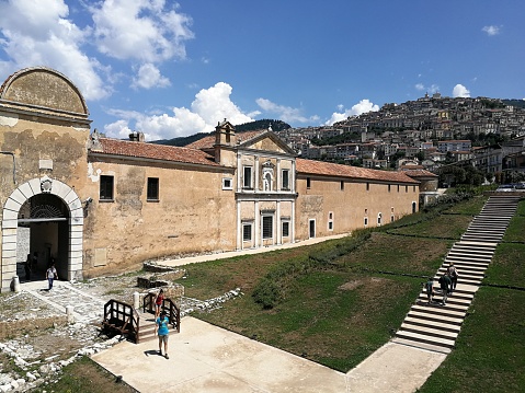Padula, Salerno, Campania, Italy - August 5, 2018: Panoramic view of the village and the Certosa di San Lorenzo
