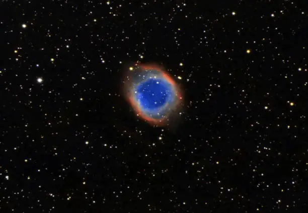 The Helix Nebula, also known as The Helix, NGC 7293, is a large planetary nebula (PN) located in the constellation Aquarius. Discovered by Karl Ludwig Harding, probably before 1824, this object is one of the closest to the Earth of all the bright planetary nebulae. The estimated distance is about 215 parsecs (700 light-years). The Helix Nebula has sometimes been referred to as the "Eye of God" in pop culture, as well as the "Eye of Sauron".