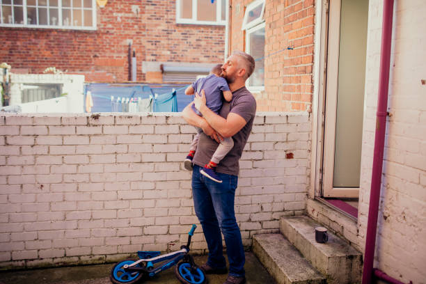 istock Mid Adult Man Comforting his Son 1019287590
