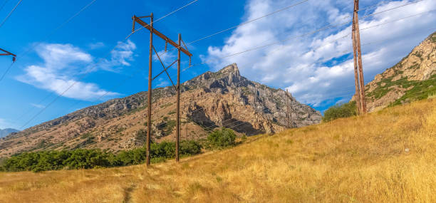 istock Yellow grass and power lines in Provo pano 1019292972