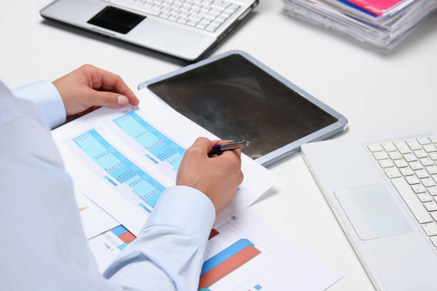 istock Business man sitting on the desk and working in office 1019299988