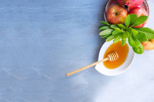 istock Apples, pomegranate and honey for Rosh Hashanah 1019306086