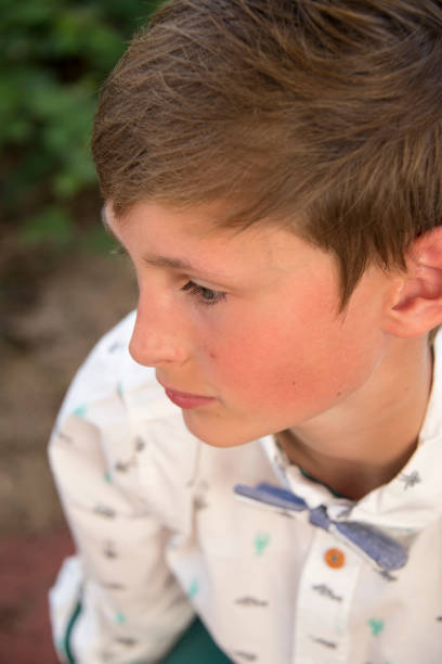 istock teen boy spring portrait confirmation 1019309216