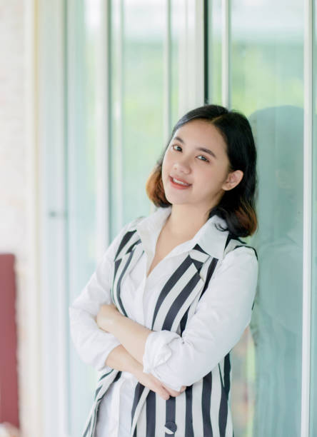 istock asain woman standing with happiness 1019309984