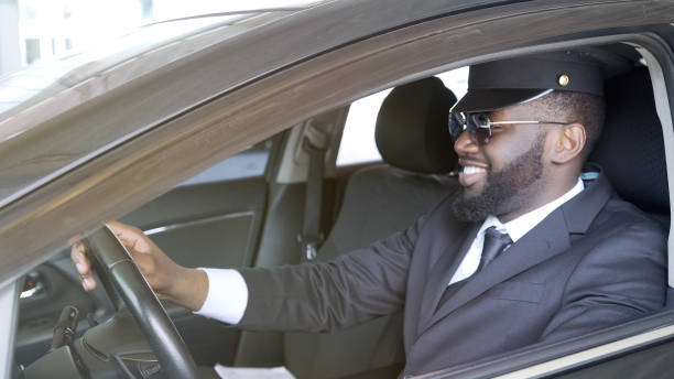 istock Smiling business driver sitting in luxury automobile, transportation service 1019312962