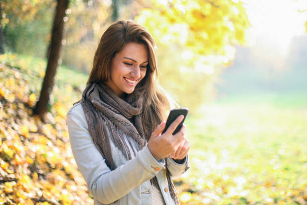 istock Young woman looking at her smart phone 1019313752