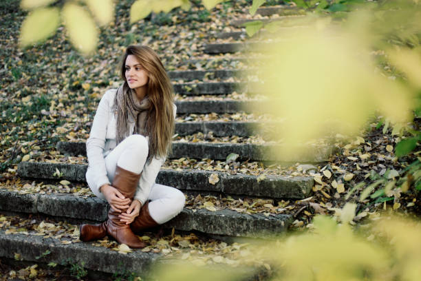 istock Beautiful woman in park 1019313776